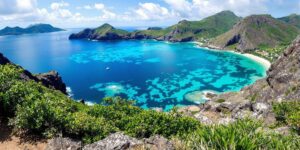 Komodo Island with turquoise waters and lush greenery.