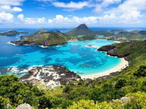 Aerial view of Komodo Island with clear waters and greenery.